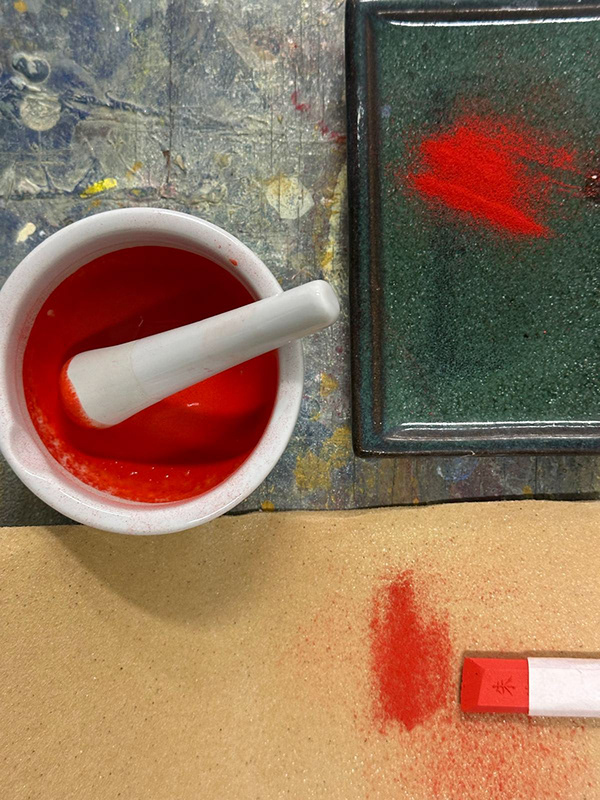 Grinding the ink stick